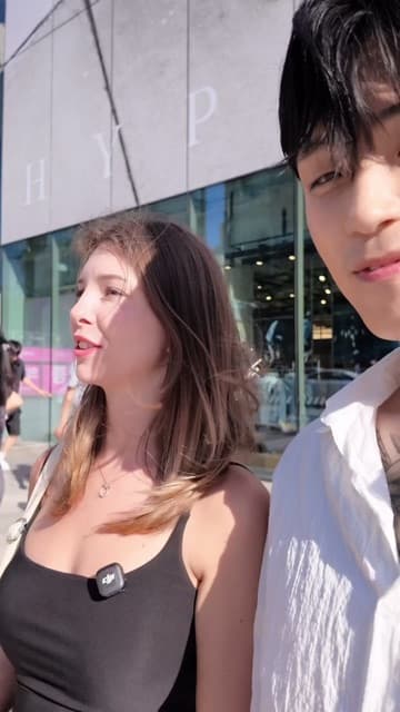 Frame from Jin's (@jinkangkr) TikTok taking a stranger to Delphic Clinic in Gangnam, Seoul, over lunch — about same-day skin treatment